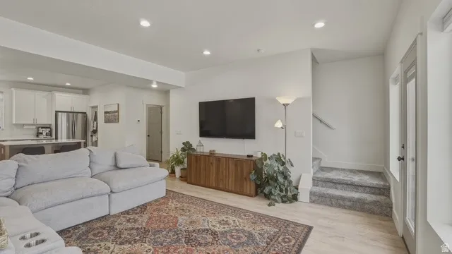 Living area featuring recessed lighting and light wood-type flooring