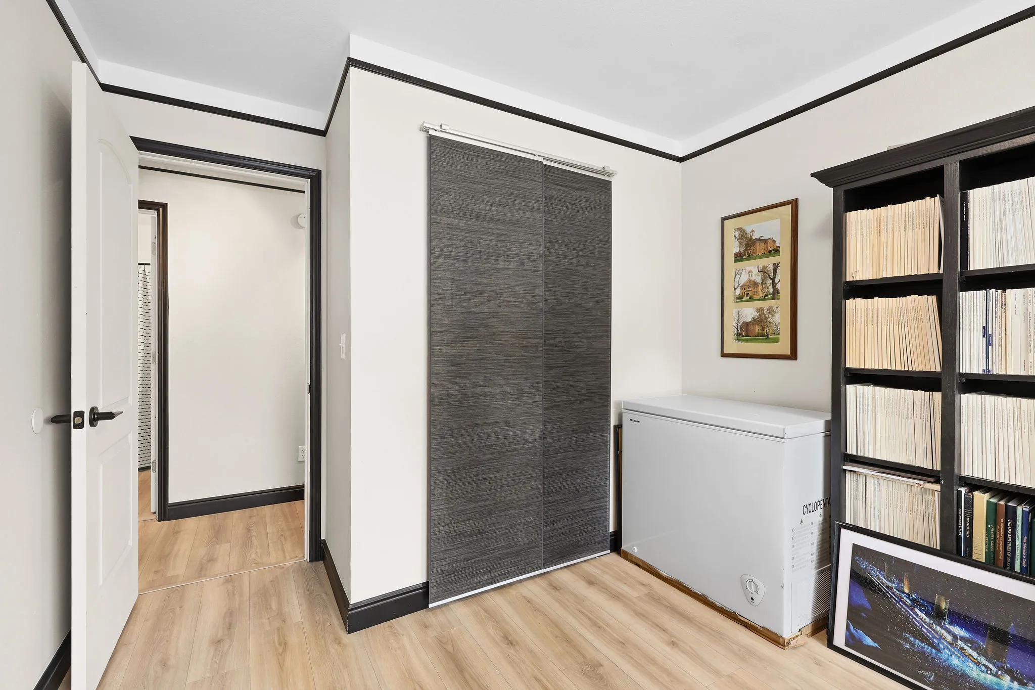 Unfurnished bedroom featuring light wood-type flooring and a closet