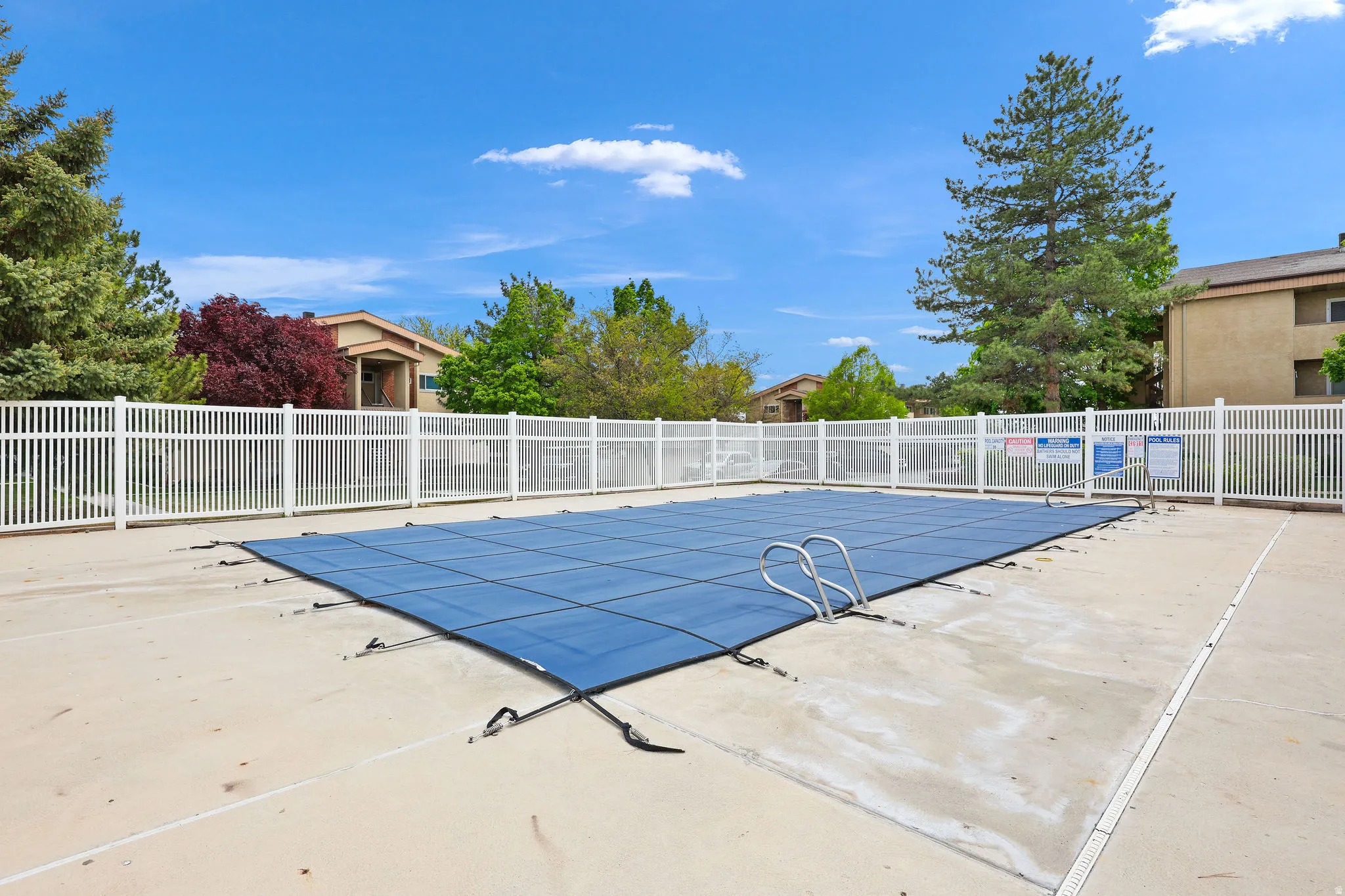 Community pool featuring a patio