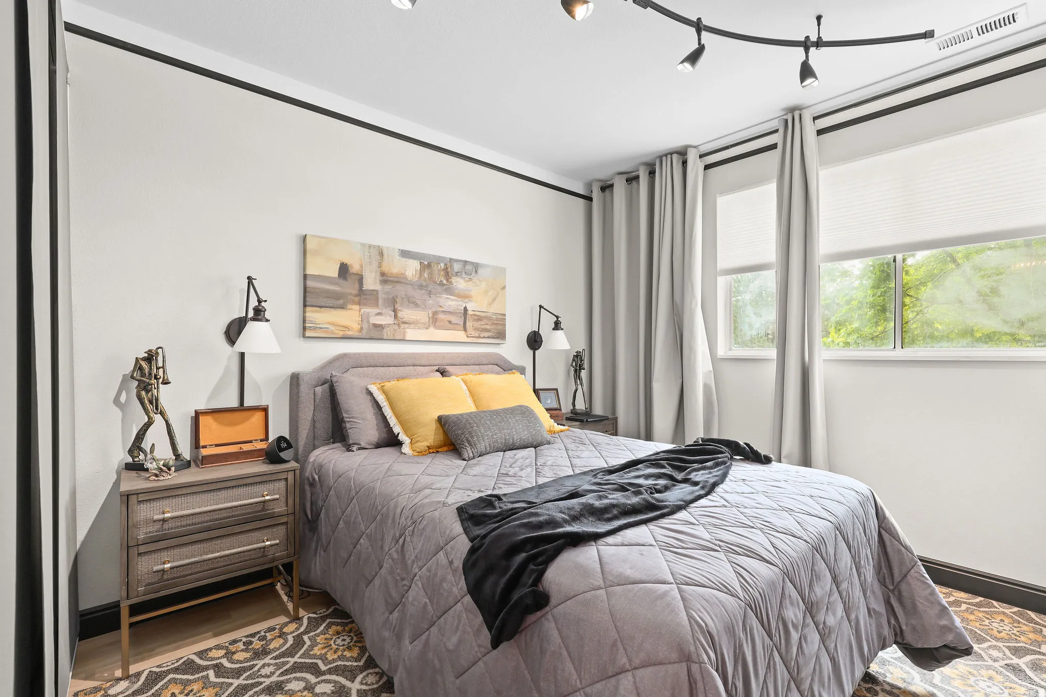 Bedroom with baseboards and wood finished floors