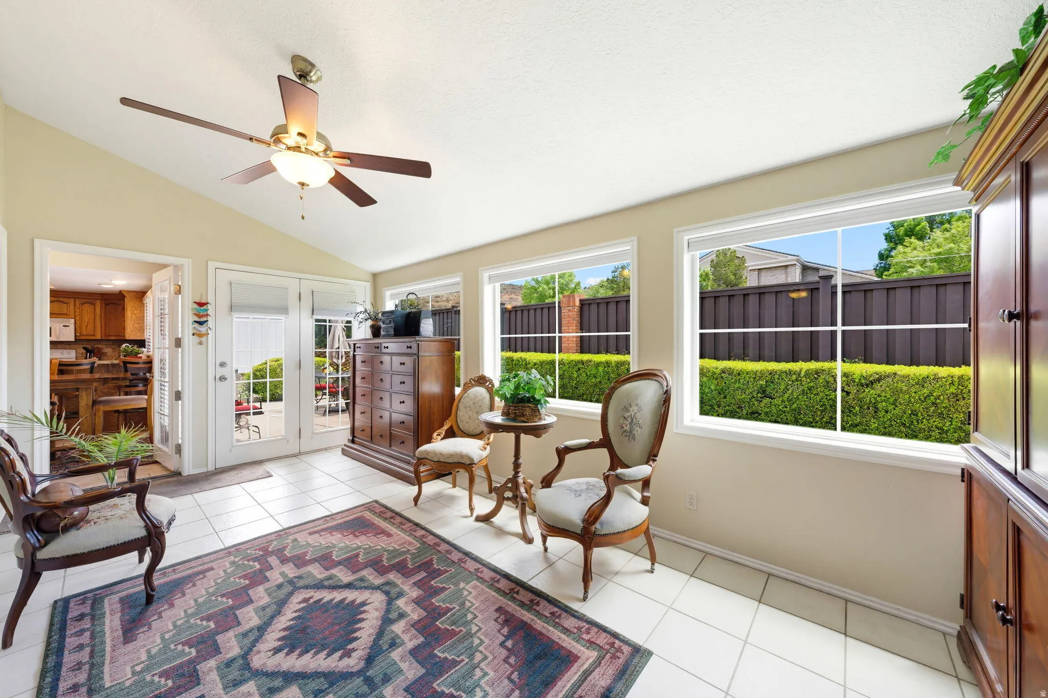 Sunroom / solarium featuring lofted ceiling