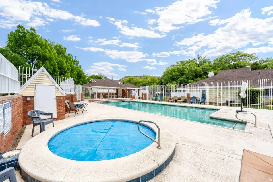Community pool featuring a patio area