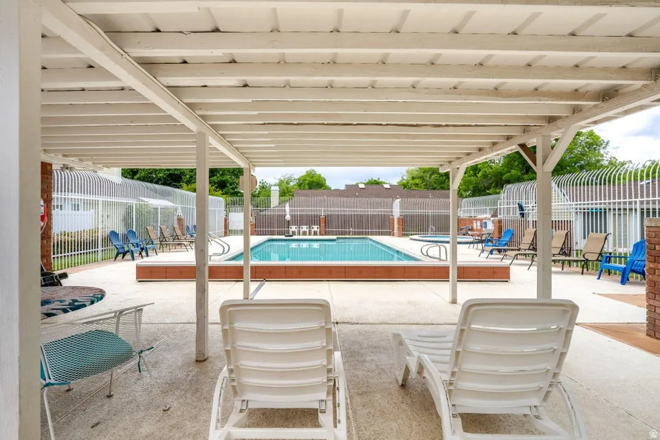 Community pool featuring a patio area