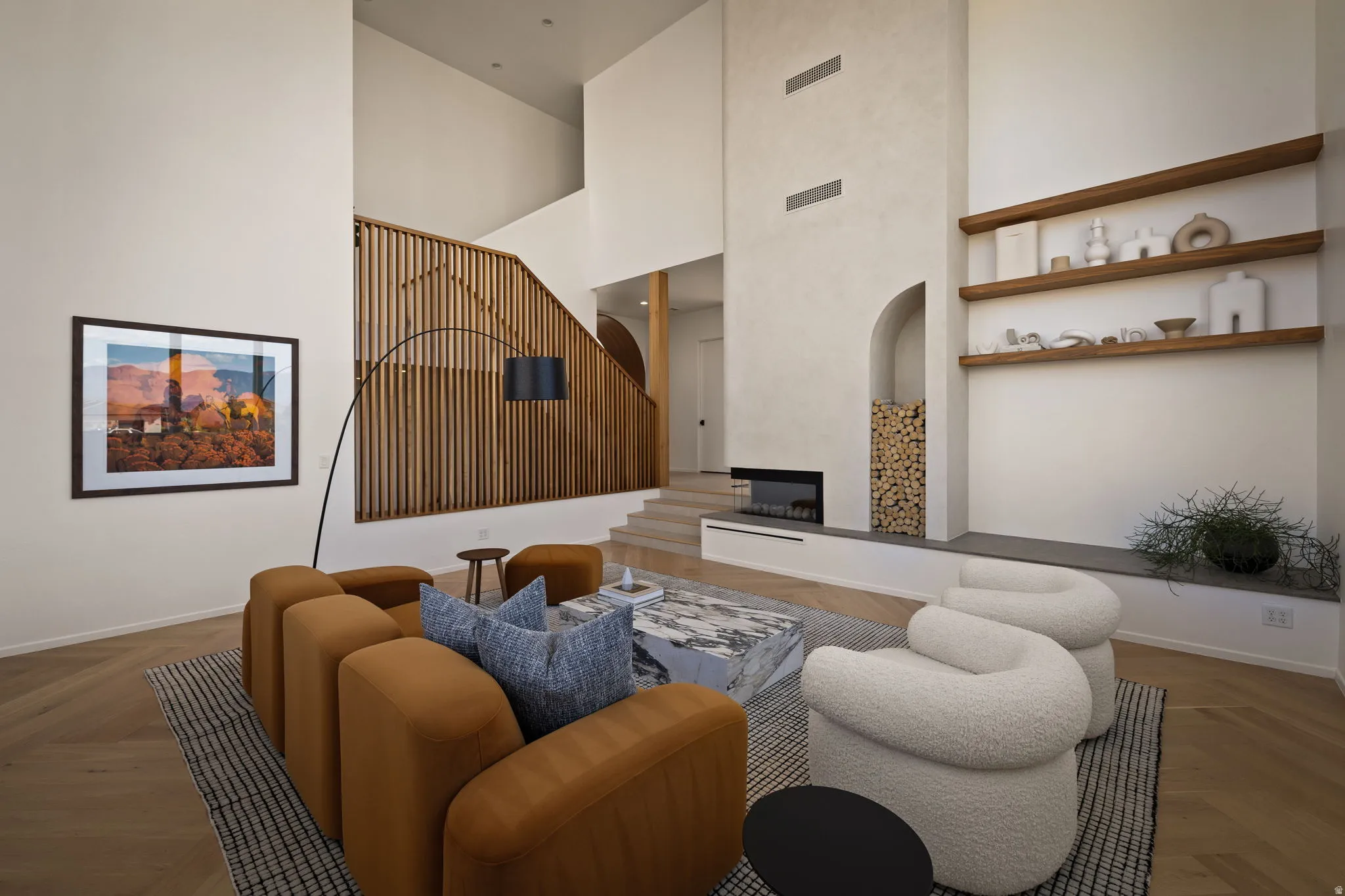 Living room with parquet flooring, a fireplace, and a high ceiling