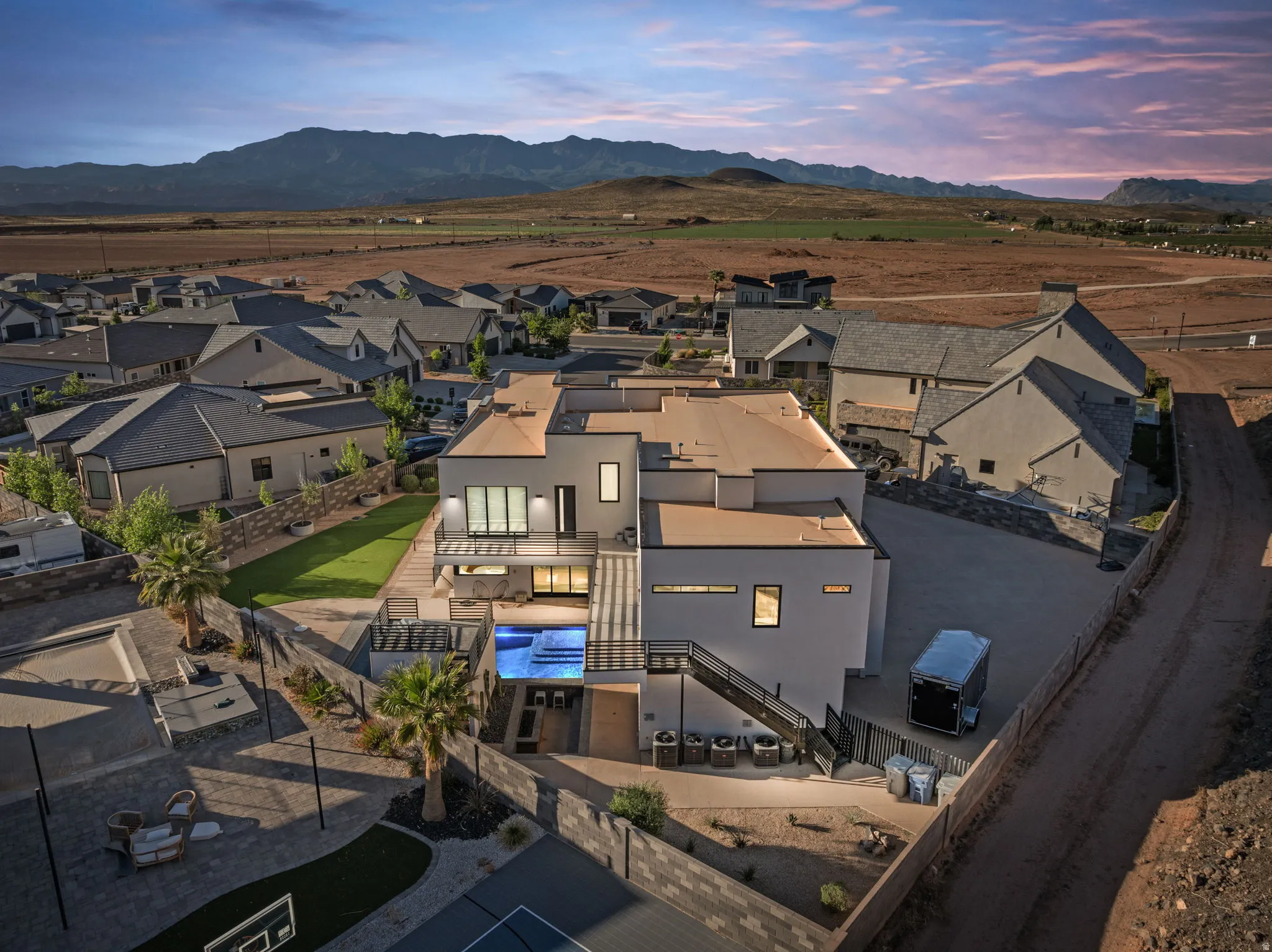 Aerial view at dusk of a residential view and a mountain view