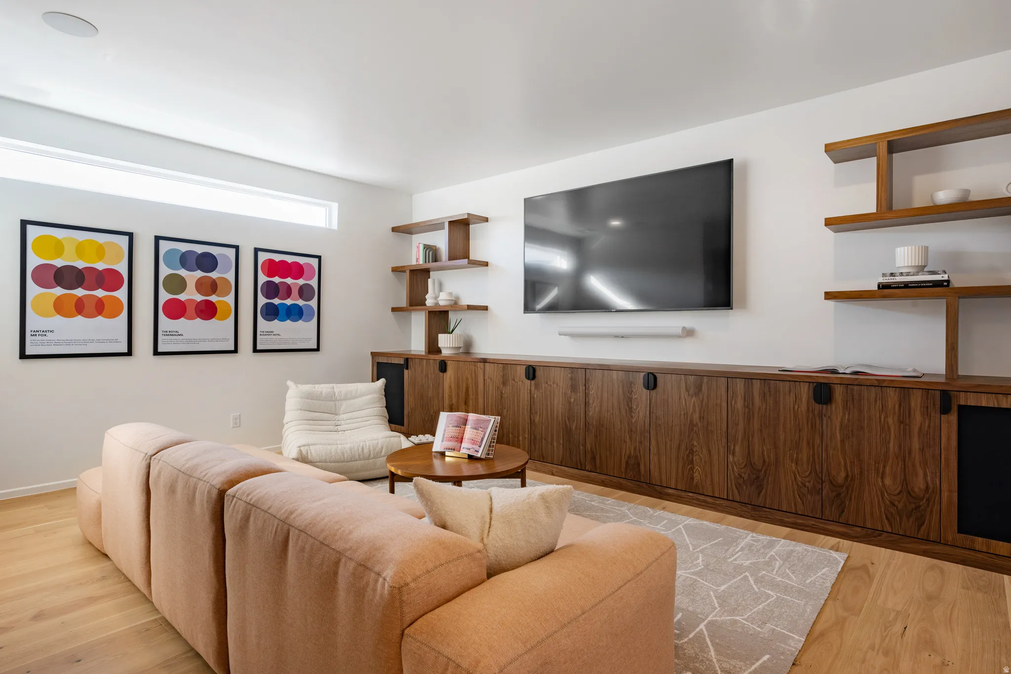 Living room with light wood-style flooring