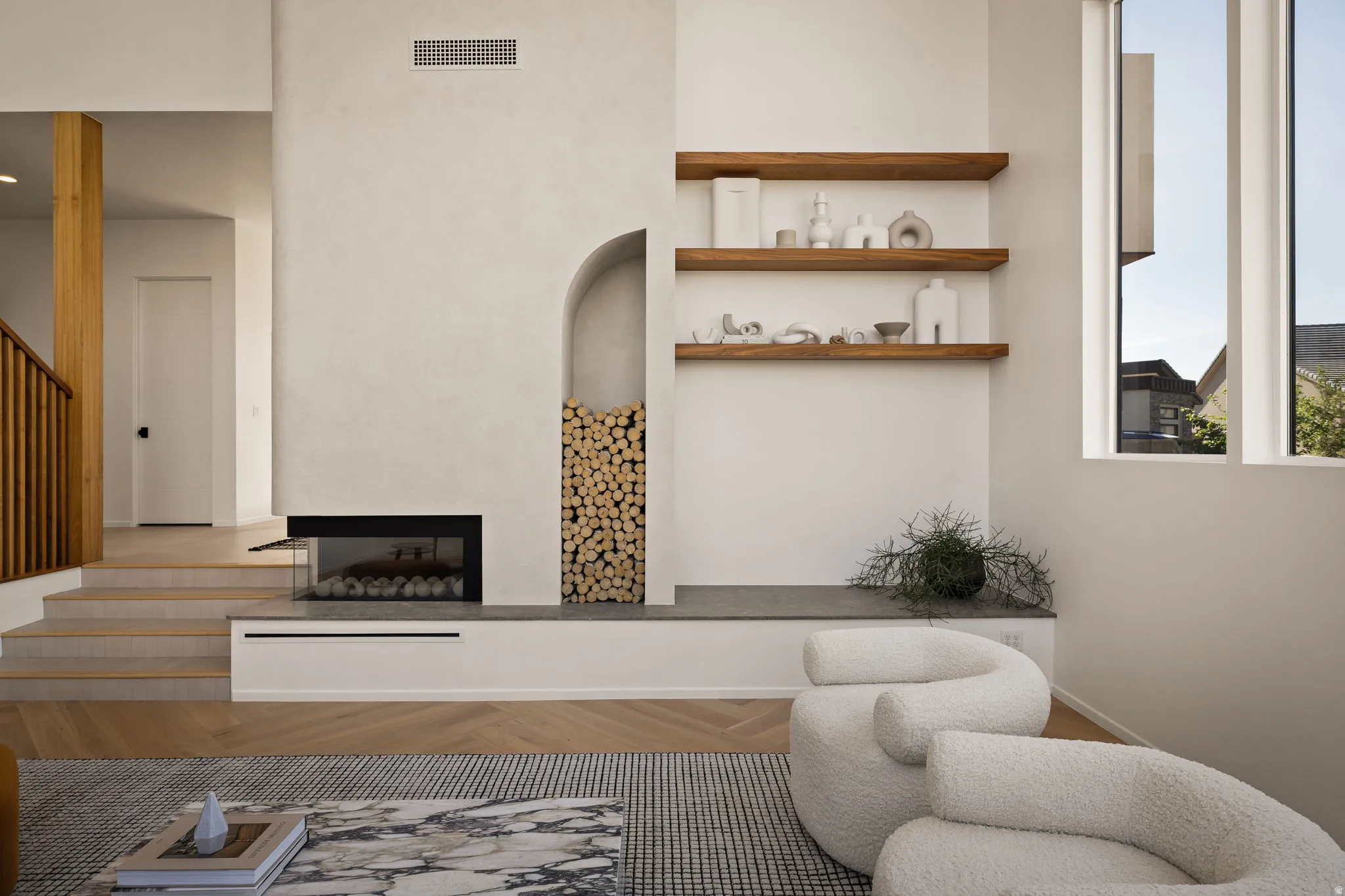 Living area featuring parquet flooring and a multi sided fireplace