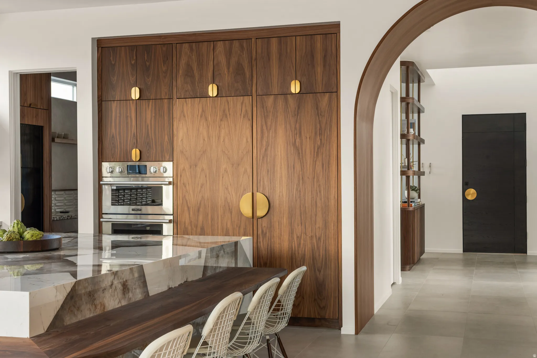 Dining space featuring arched walkways