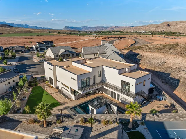 Aerial perspective of suburban area with a mountain backdrop
