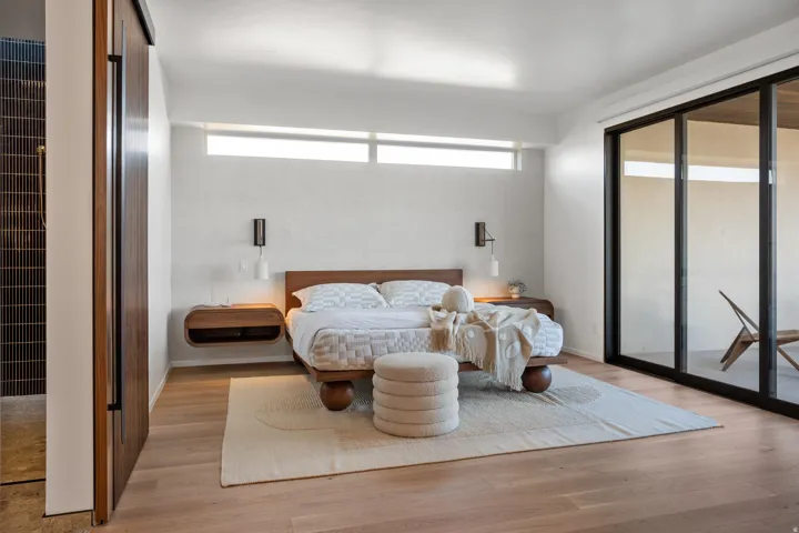 Bedroom with light wood-style flooring and access to outside