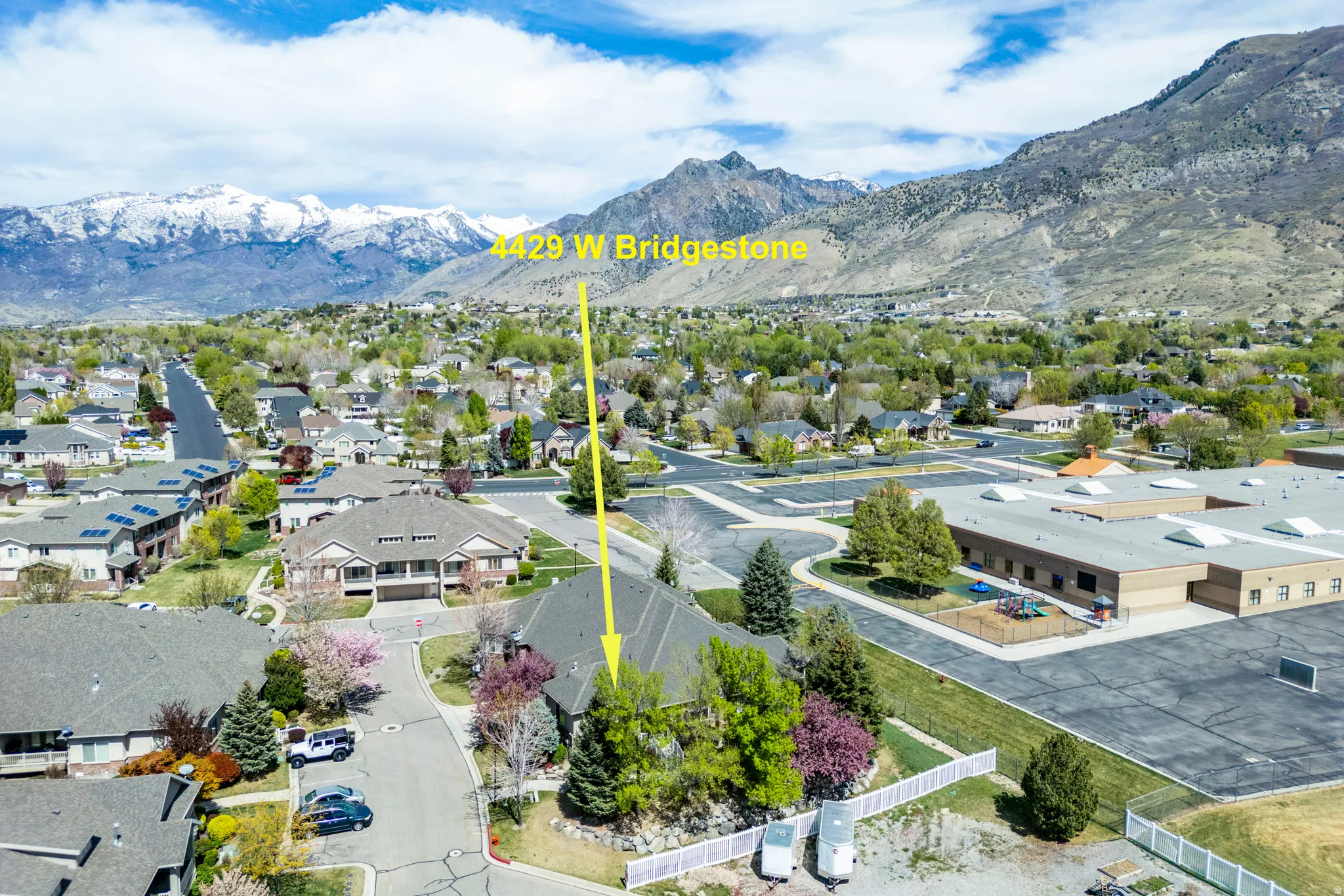 Aerial perspective of suburban area with a mountainous background