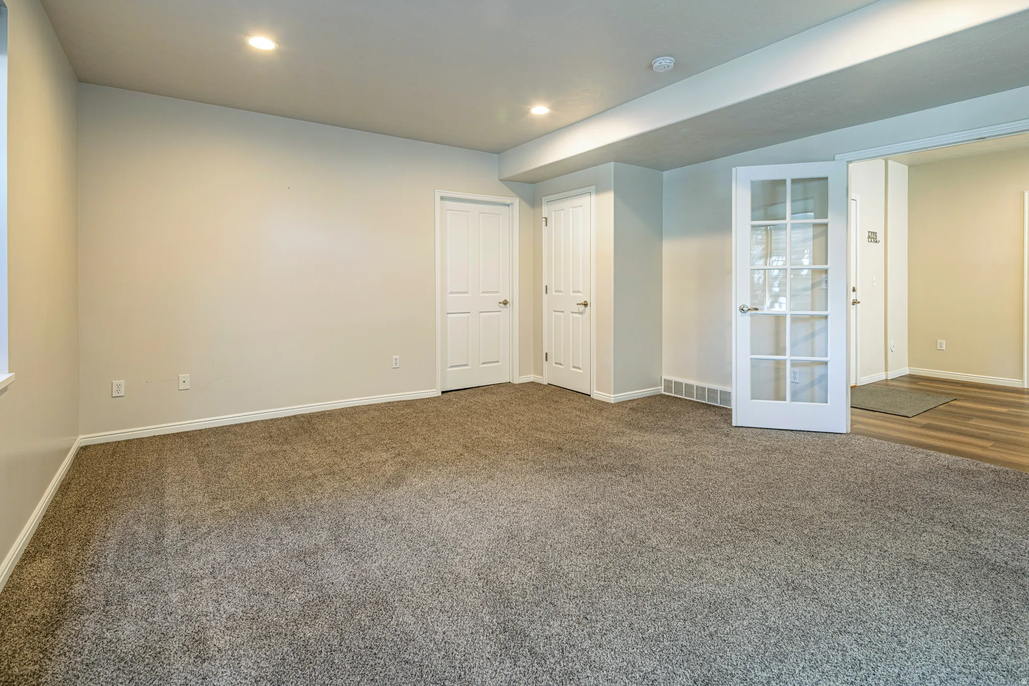 Unfurnished bedroom featuring carpet and recessed lighting