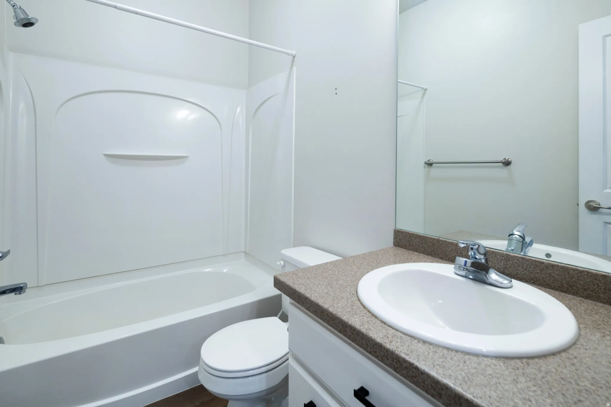 Bathroom featuring vanity and shower / bathtub combination