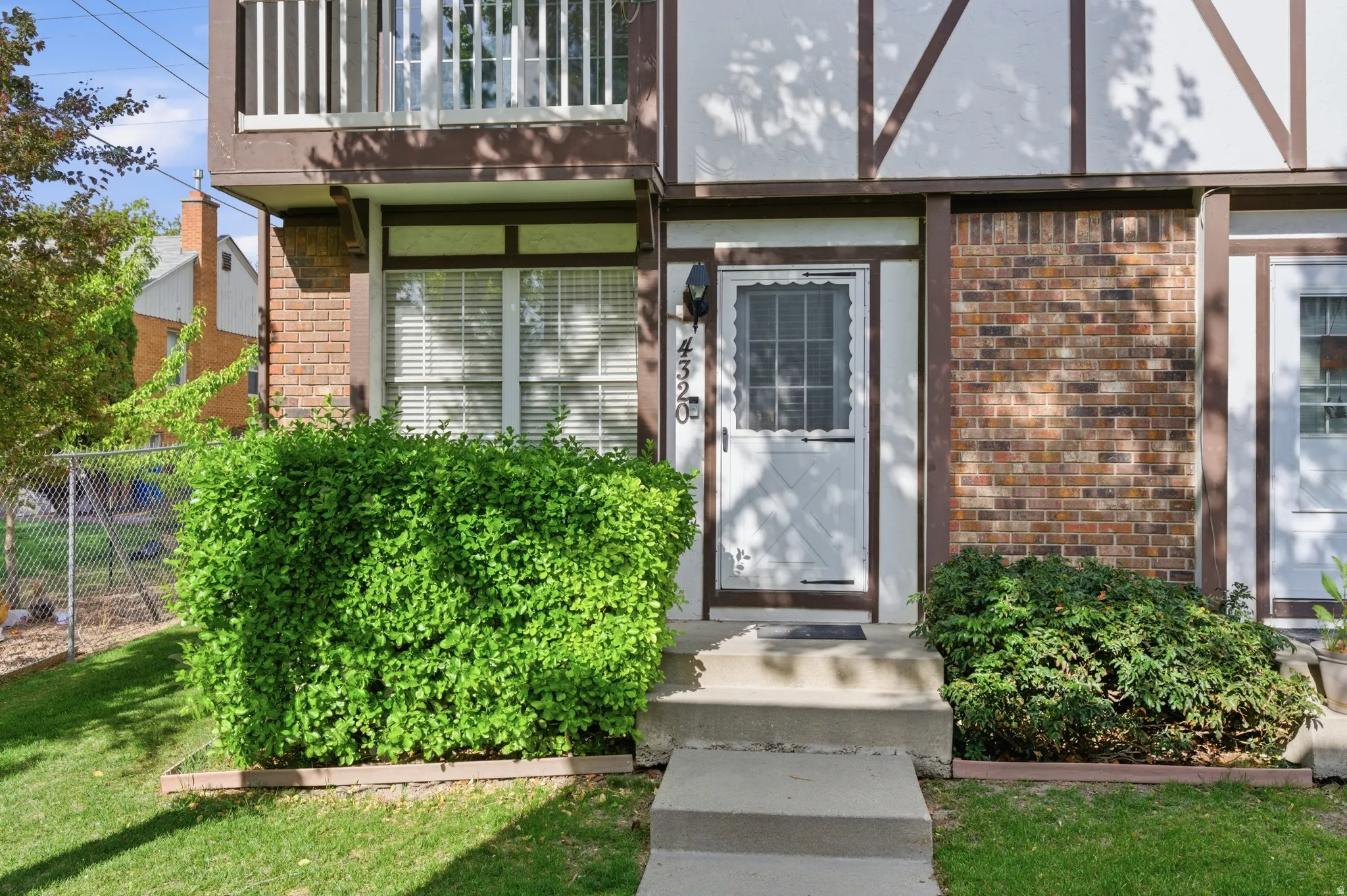 Entrance to property with brick siding