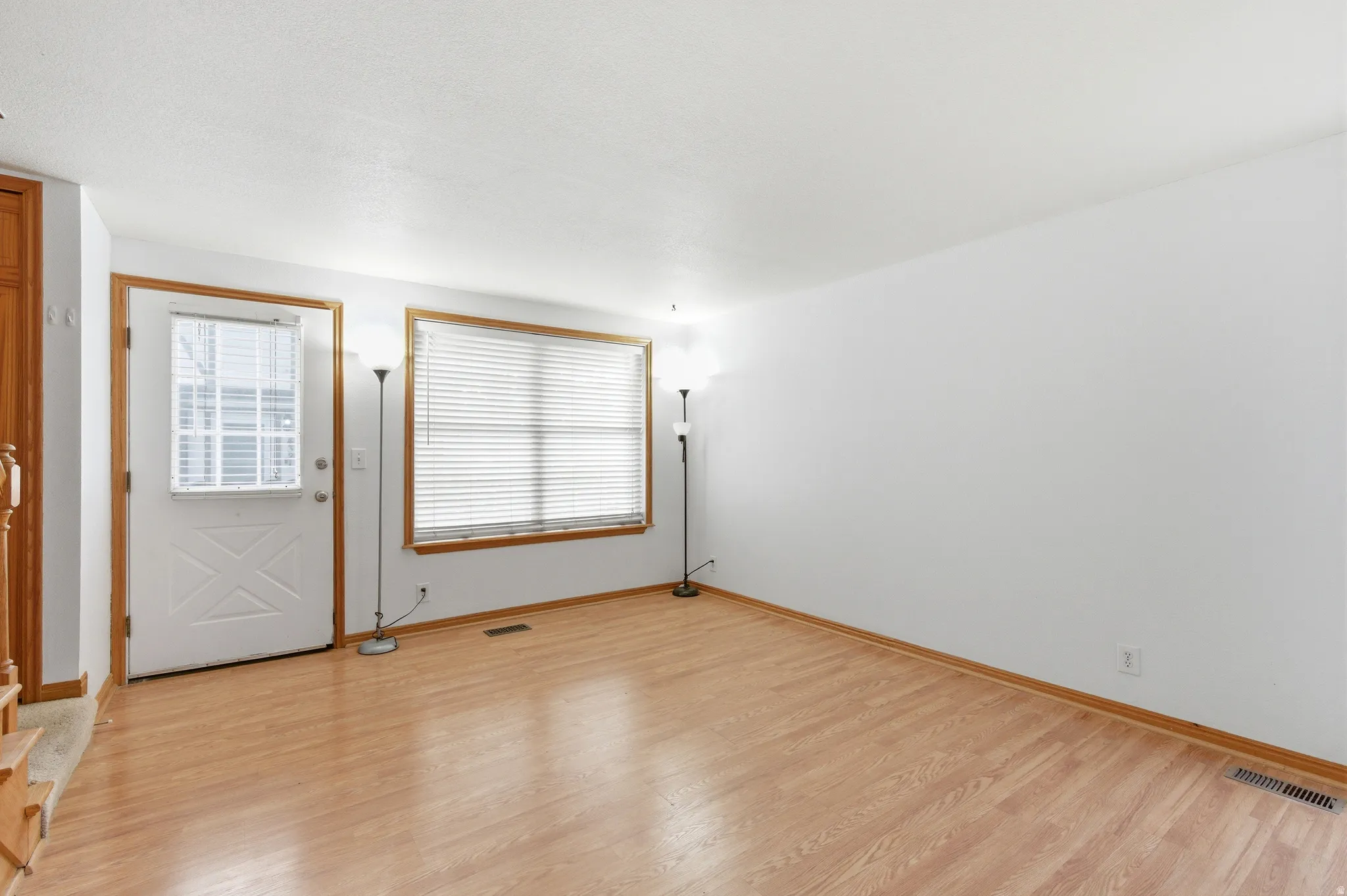 Entryway featuring plenty of natural light and light wood-style floors