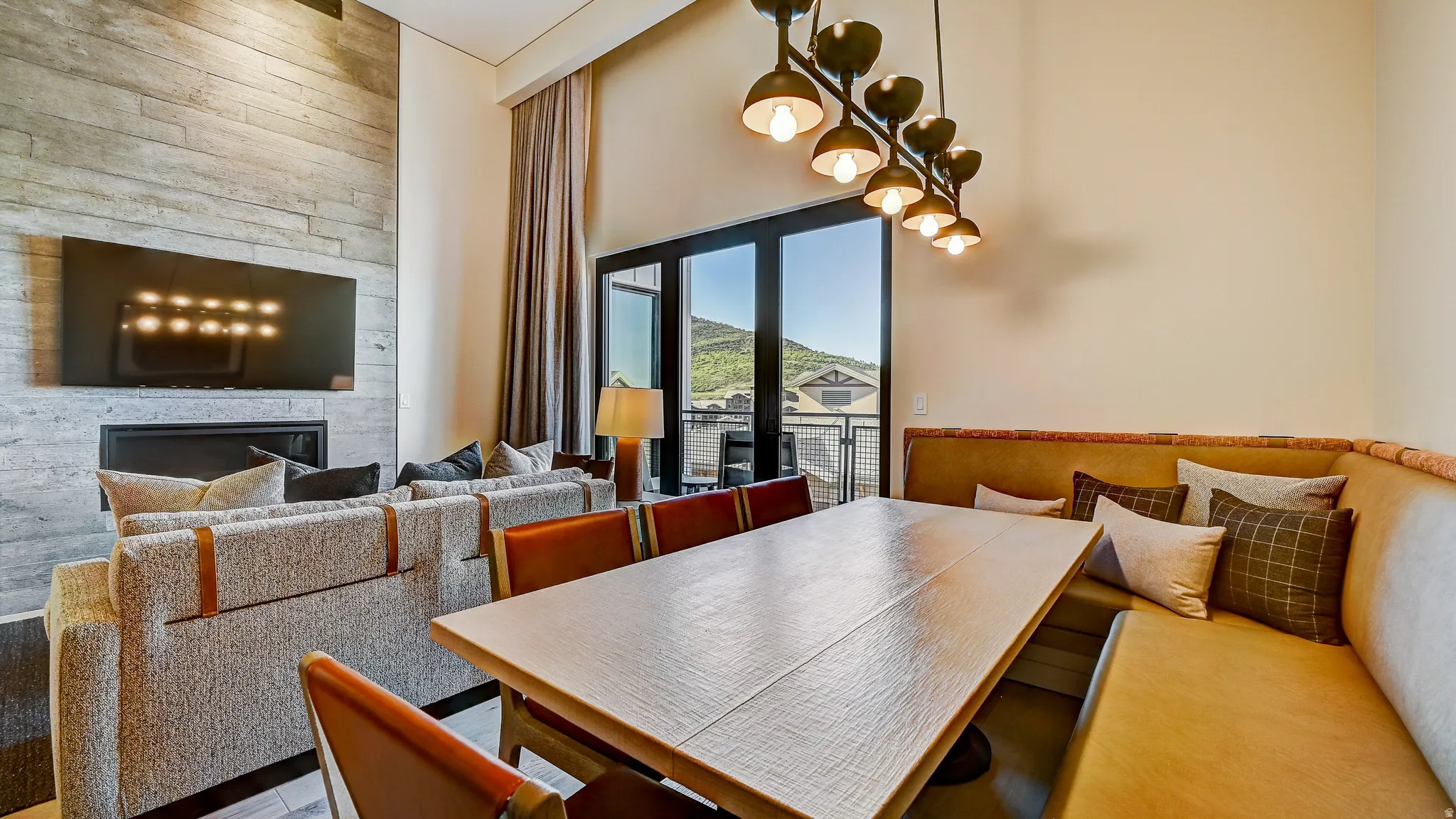 Dining room featuring a high ceiling and a large fireplace
