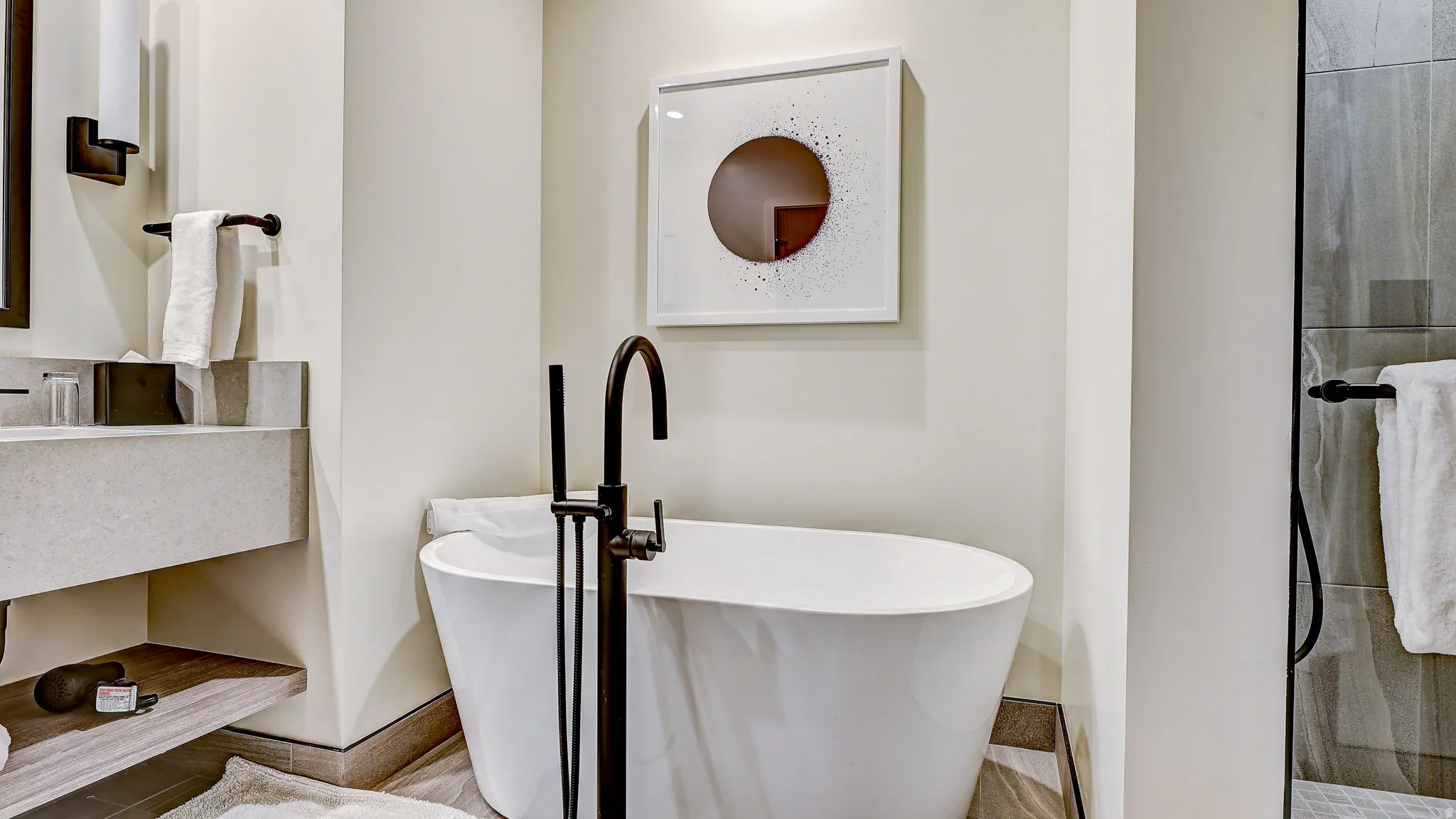 Bathroom featuring a freestanding bath and vanity