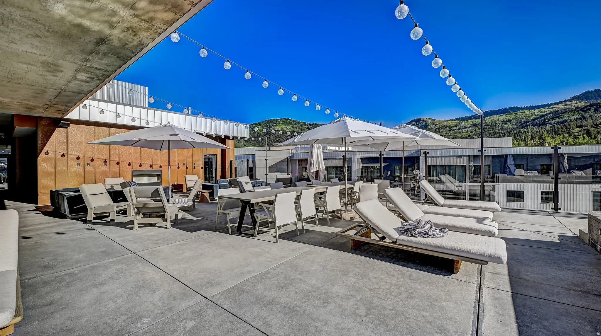 View of patio / terrace featuring a mountain view and outdoor dining space