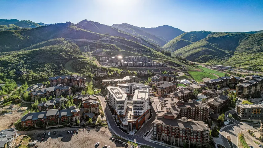 Aerial view of property's location with a mountain backdrop