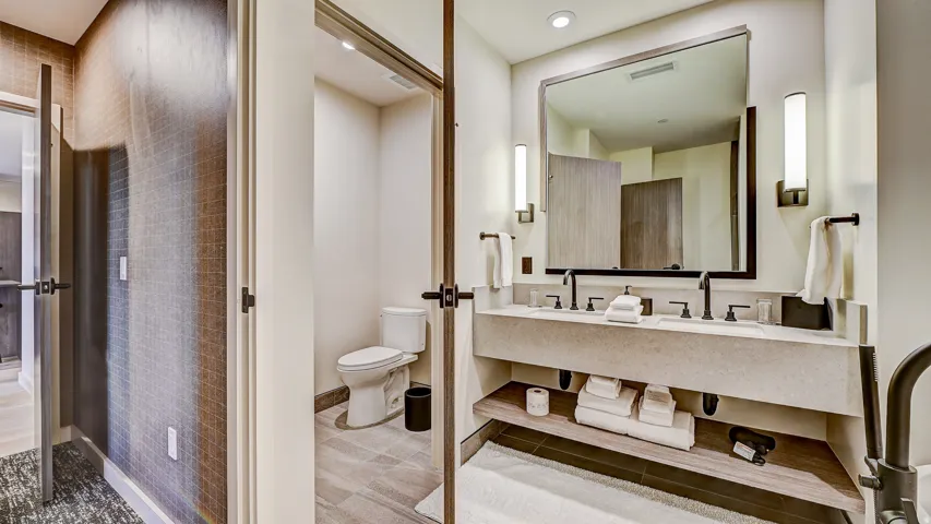 Bathroom with toilet and double vanity