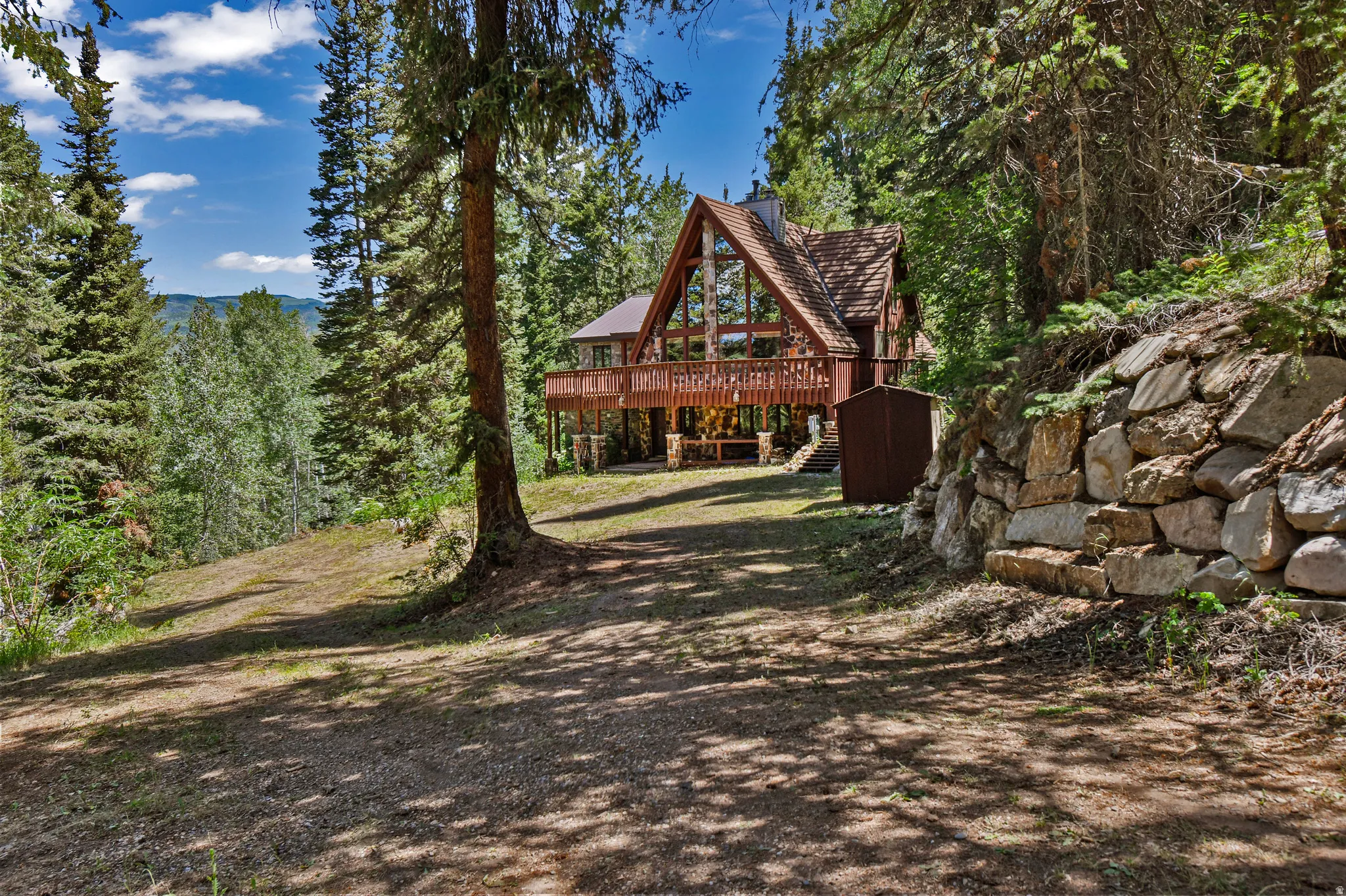 View of yard featuring a deck and stairway