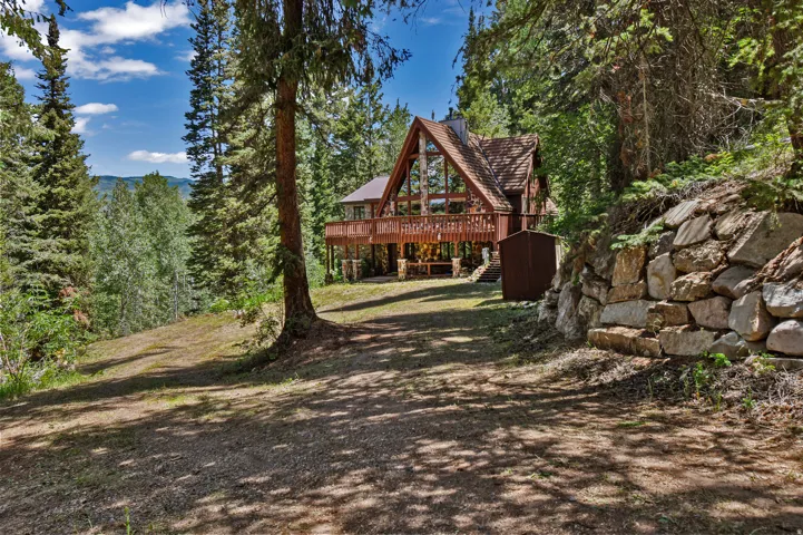 View of yard featuring a deck and stairway