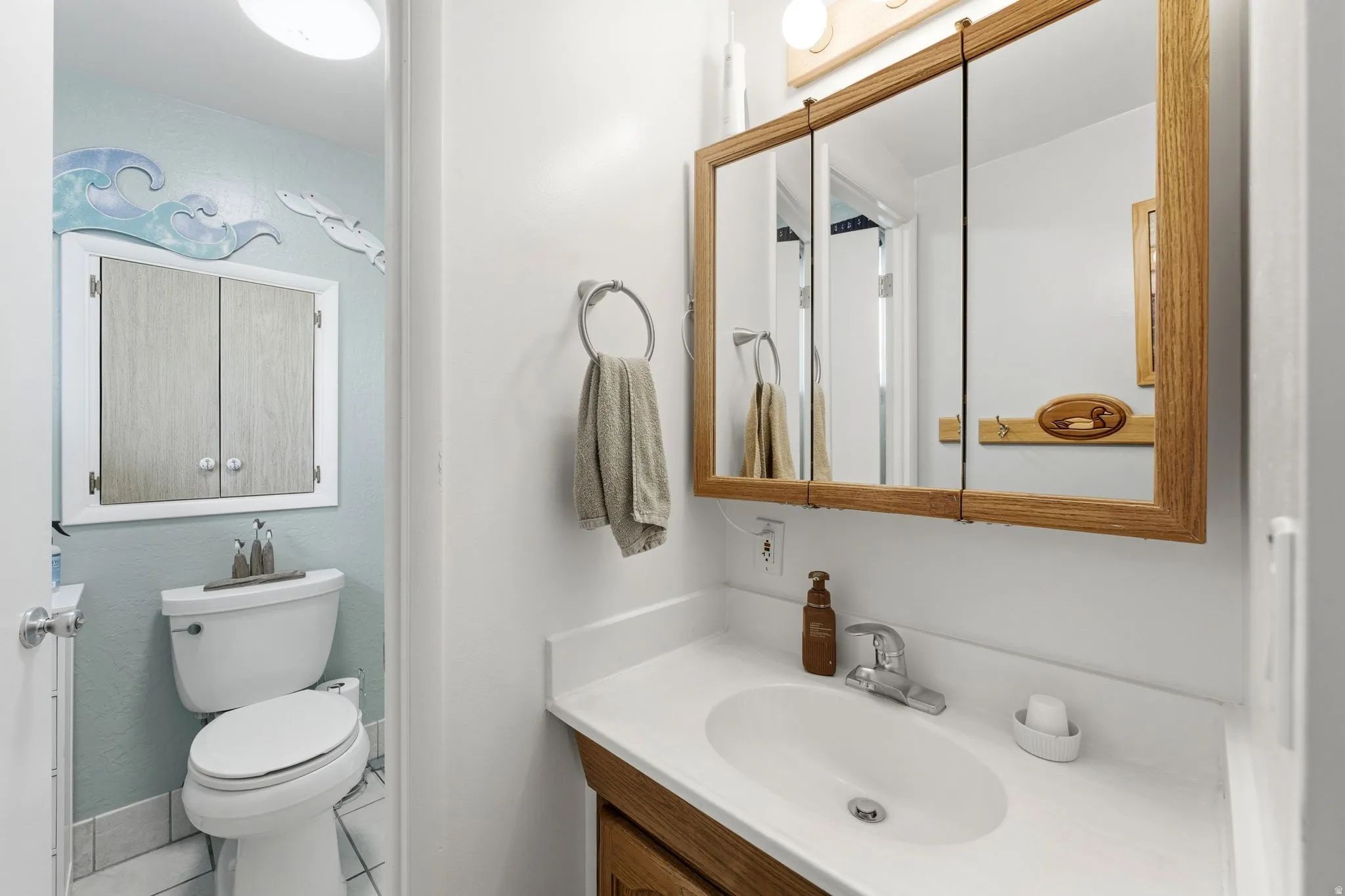 Bathroom featuring vanity and tile patterned flooring