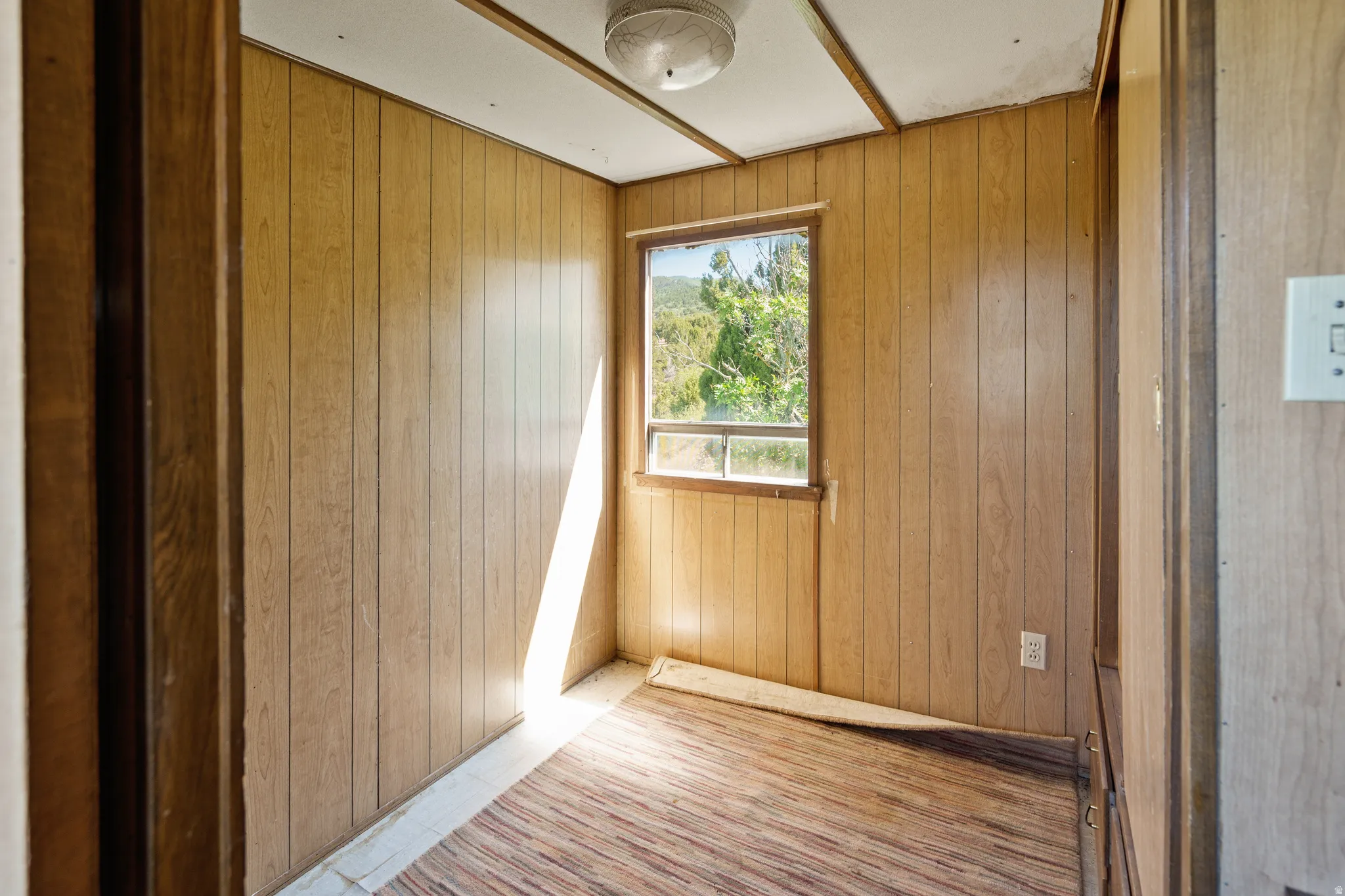 Empty room with wood walls