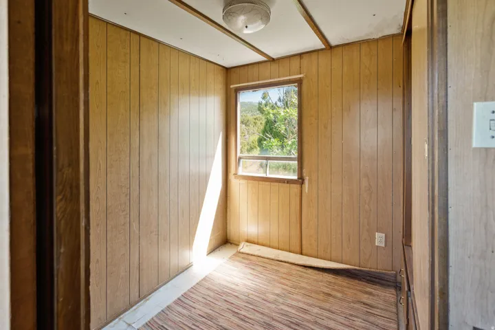 Empty room with wood walls