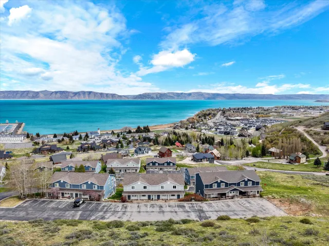 Aerial perspective of suburban area with a water and mountain view