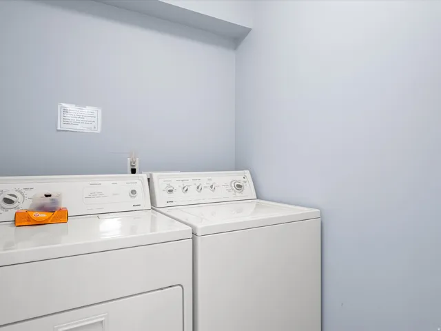 Laundry area featuring washing machine and clothes dryer