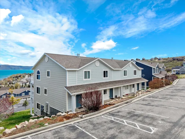 View of property featuring uncovered parking, a mountain view, and a residential view