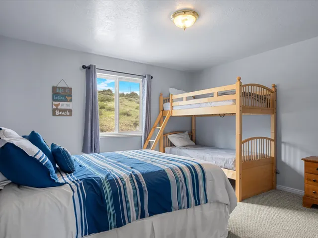 Bedroom with carpet flooring and a textured ceiling