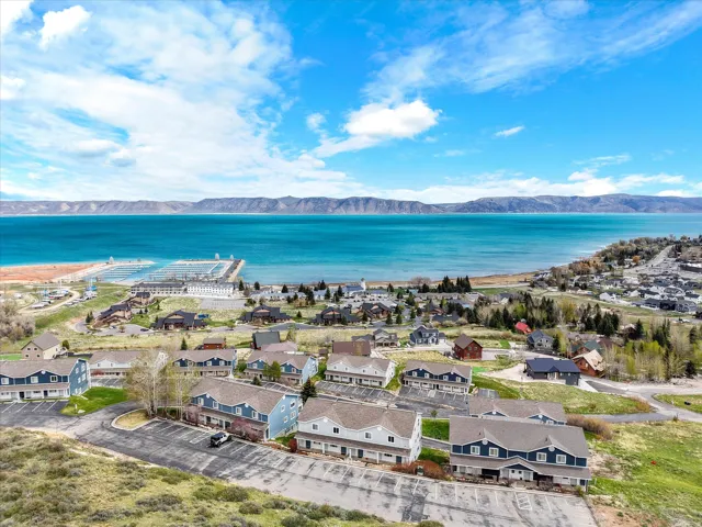 Aerial perspective of suburban area featuring a water and mountain view
