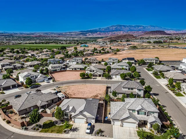 Aerial view of residential area featuring a mountain backdrop