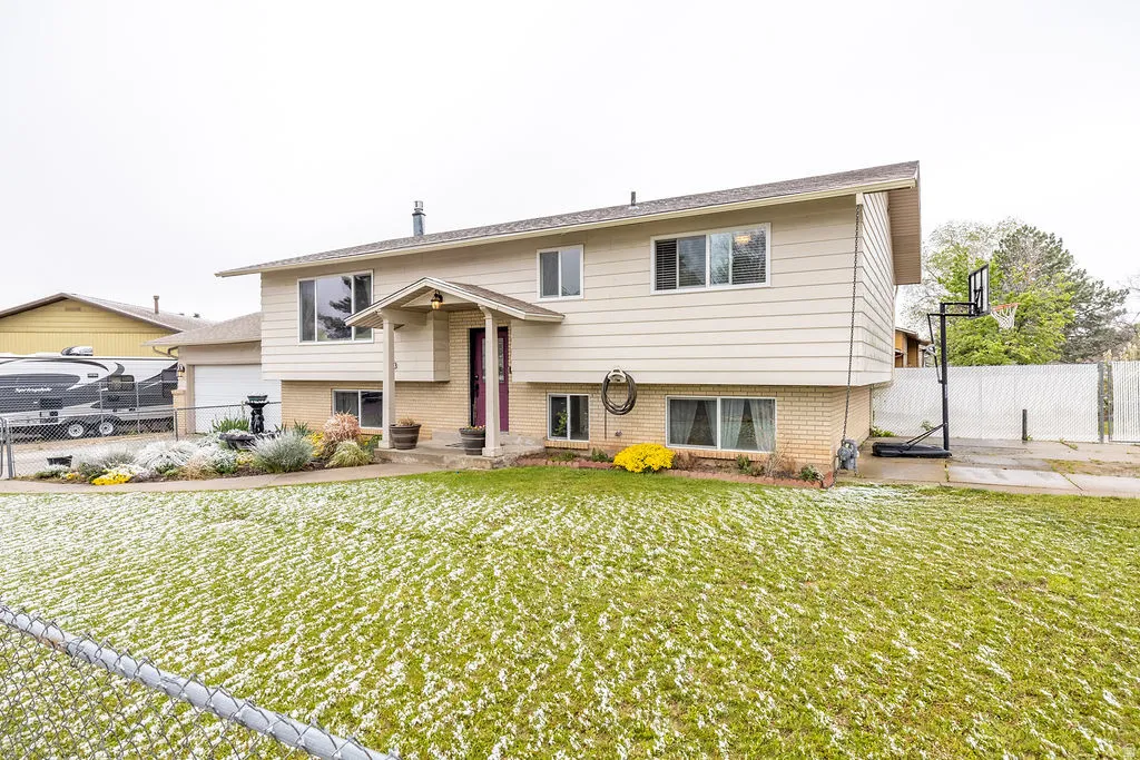 Bi-level home featuring brick siding