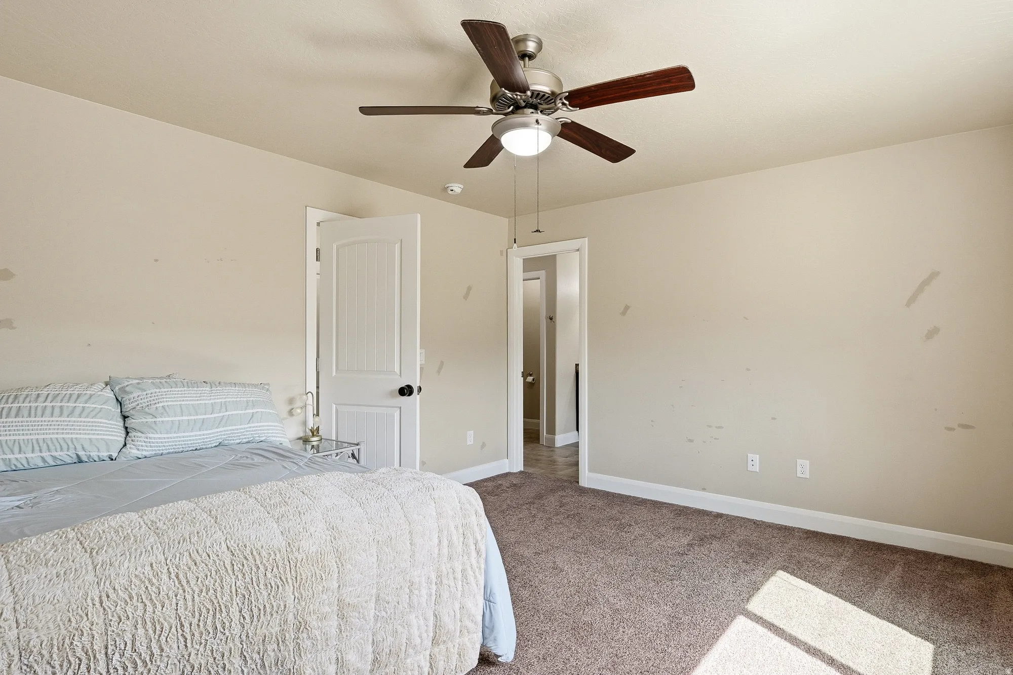 Bedroom with carpet and ceiling fan