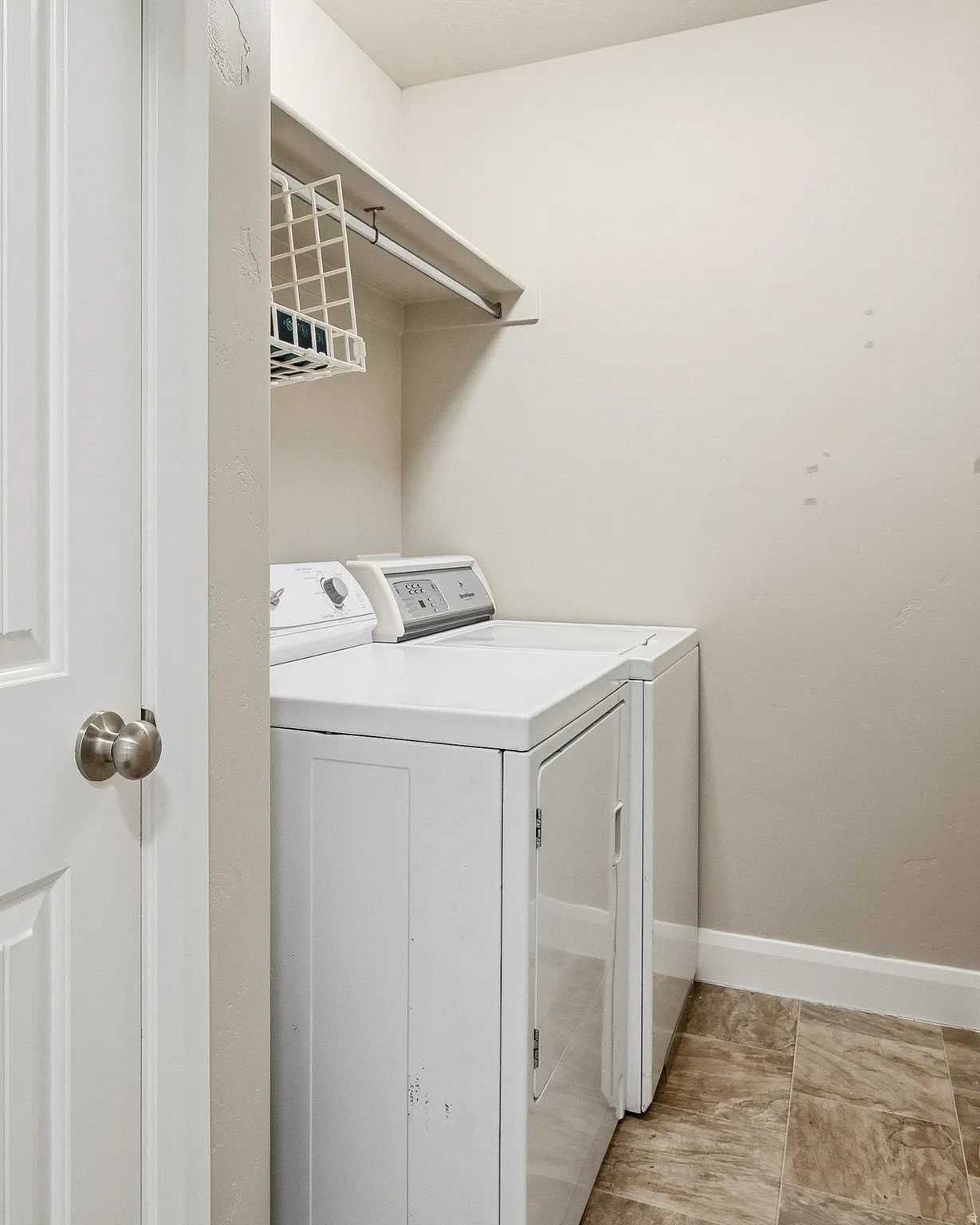 Laundry room with washer and clothes dryer