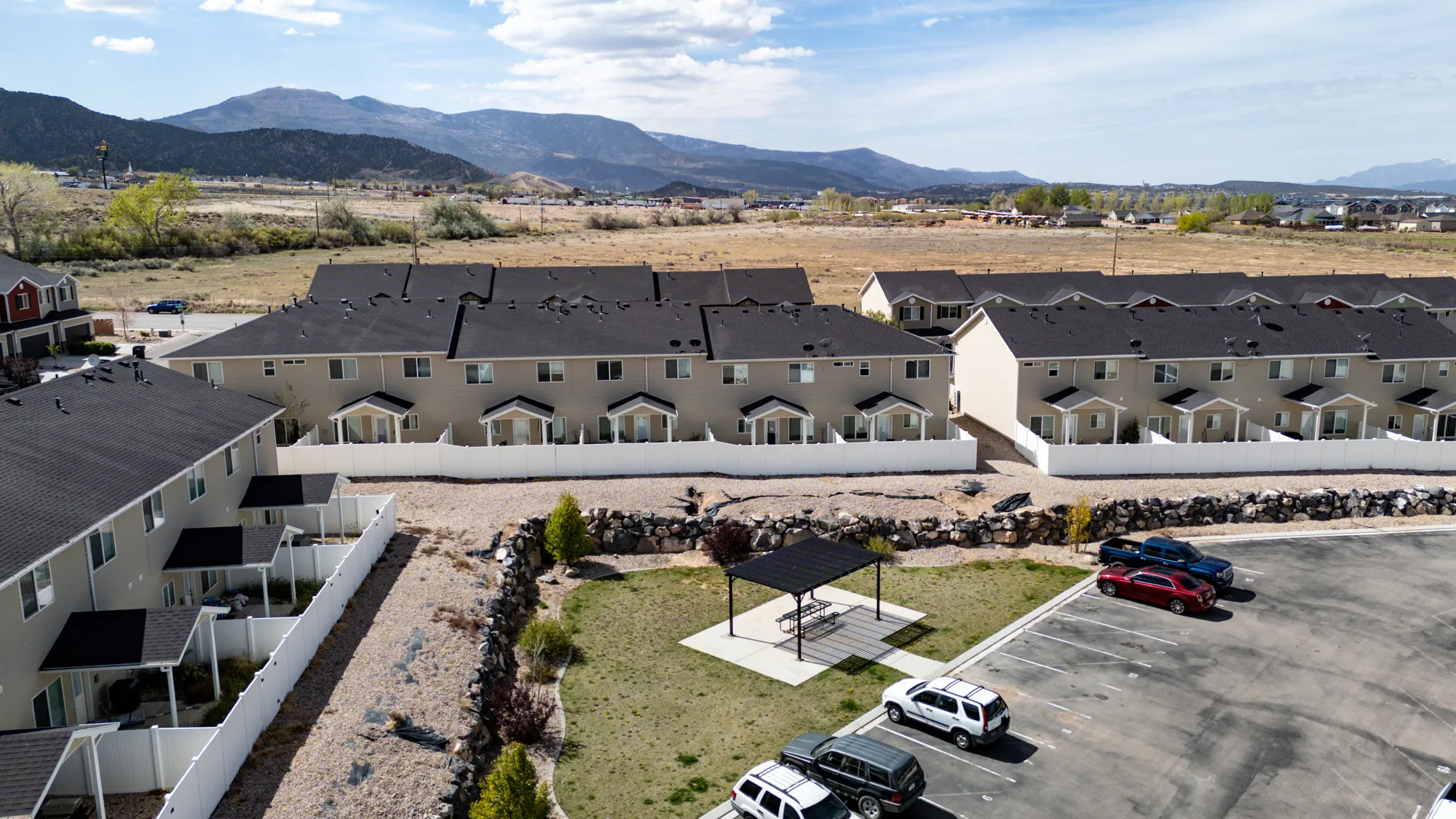 Aerial perspective of suburban area featuring a mountainous background