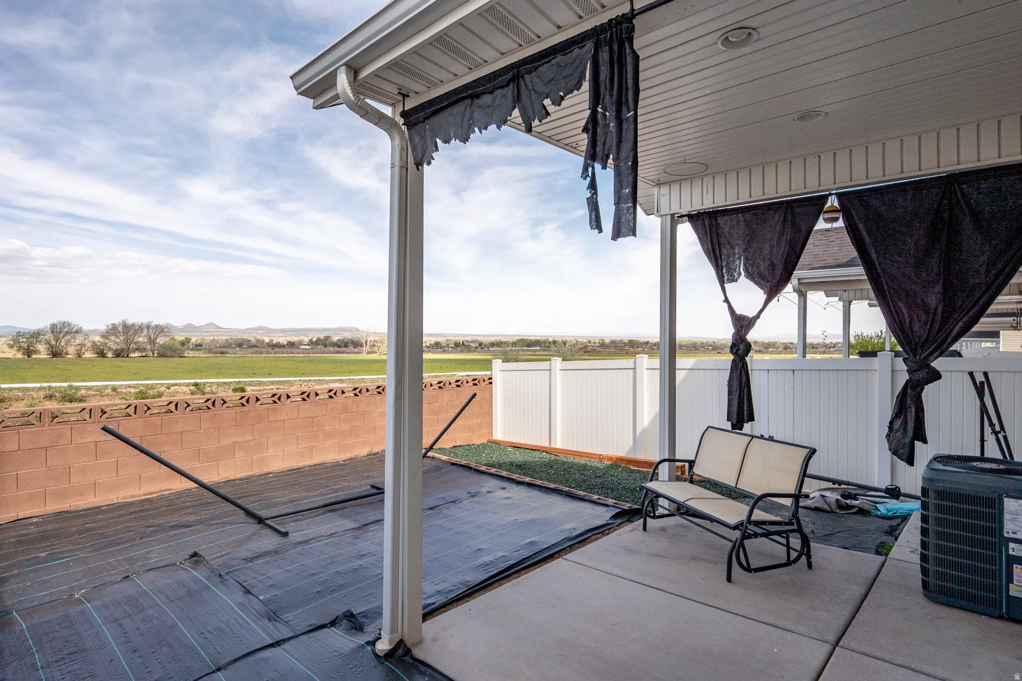 Fenced backyard featuring a patio