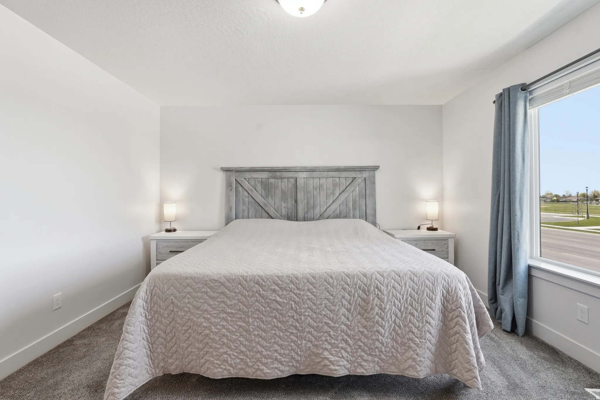 Bedroom with baseboards and carpet