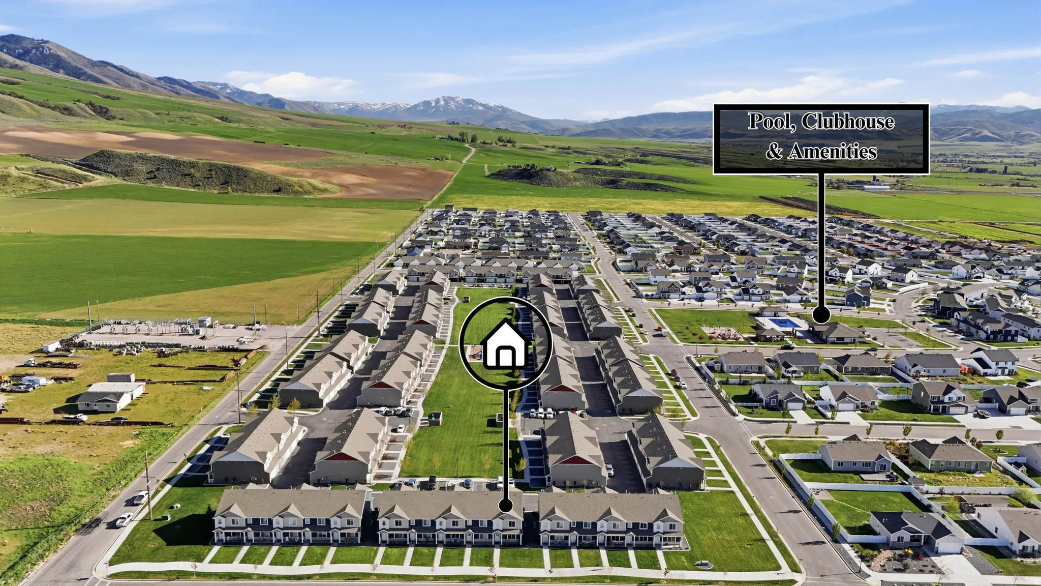 Aerial perspective of suburban area featuring a mountain backdrop