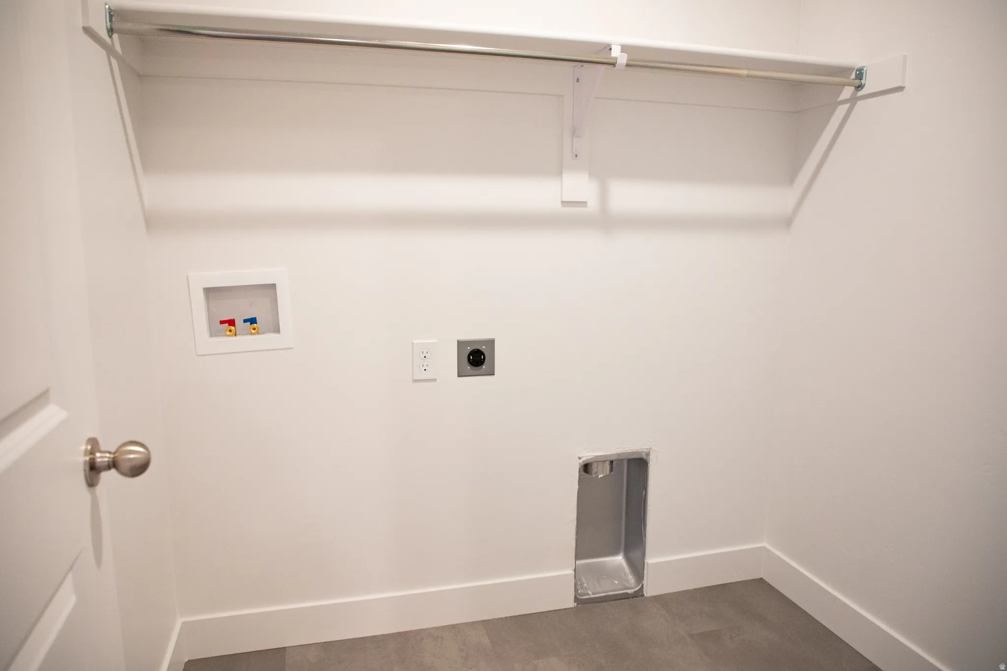 Laundry room with hookups for an electric washer and dryer