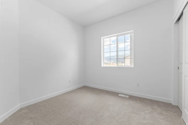 Neutral-toned carpeting paired with white walls