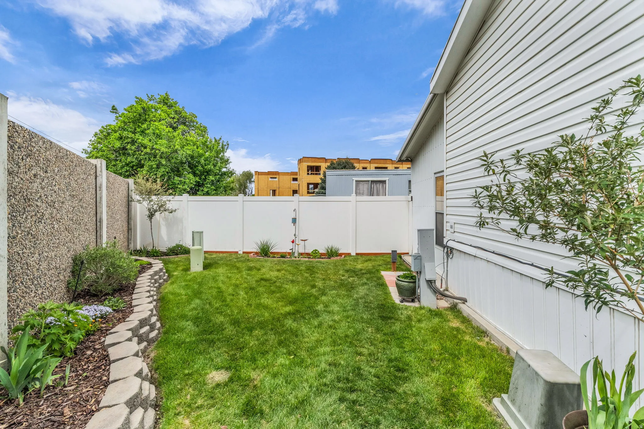 View of fenced backyard