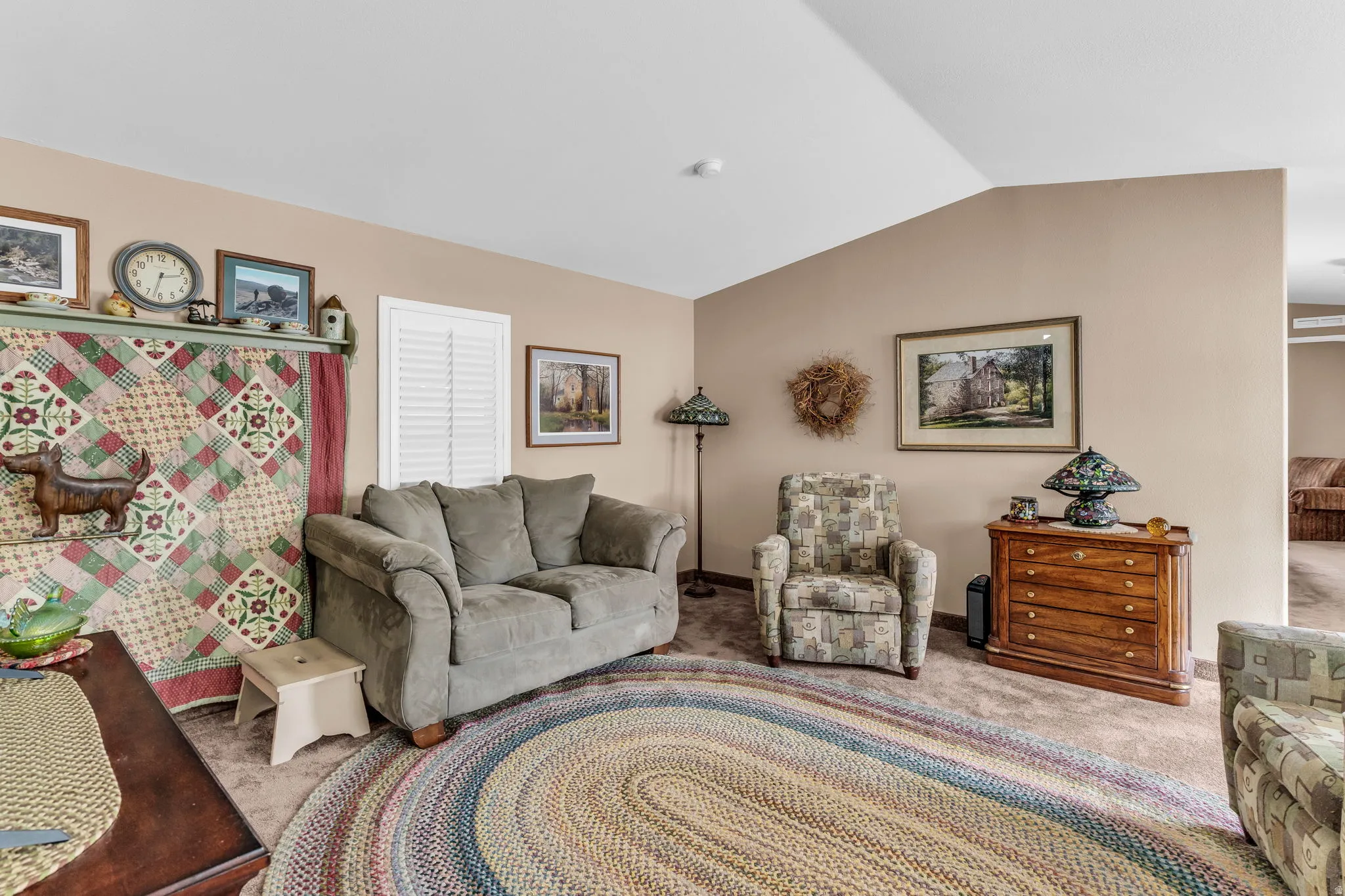 Living area featuring carpet and baseboards
