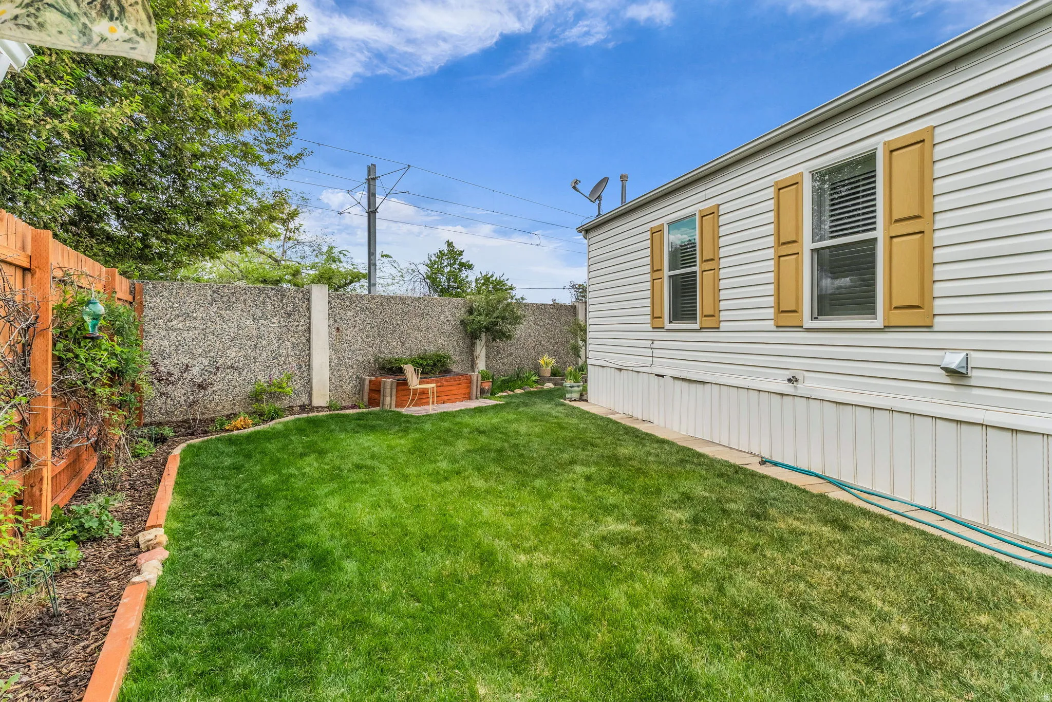 View of fenced backyard