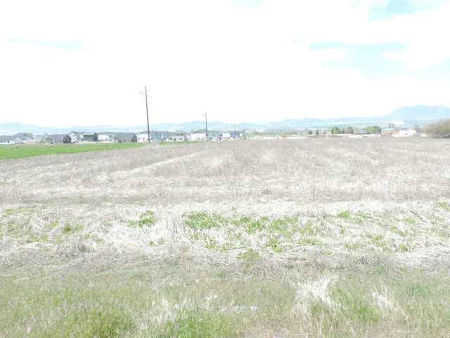 View of mountain backdrop featuring rural landscape