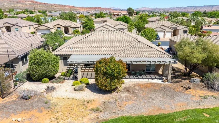 Aerial perspective of suburban area with a mountainous background
