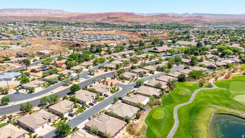 View of property location with mountains and nearby suburban area